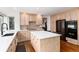 Bright kitchen featuring quartz countertops, stainless appliances, and light wood cabinetry at 8047 S Fairfax Ct, Centennial, CO 80122