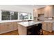 Well-lit kitchen with an island and ample counter space at 8047 S Fairfax Ct, Centennial, CO 80122