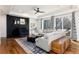 Bright living room with fireplace, hardwood floors, and natural light at 8047 S Fairfax Ct, Centennial, CO 80122