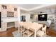 Open-concept living room with fireplace and adjacent built-in desk at 8047 S Fairfax Ct, Centennial, CO 80122