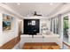 Bright living room with fireplace, hardwood floors, and crown molding at 8047 S Fairfax Ct, Centennial, CO 80122