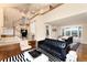 Spacious living room with hardwood floors, high ceilings, and large windows at 8047 S Fairfax Ct, Centennial, CO 80122