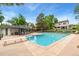 Community pool and recreation area with lounge chairs and a covered seating area at 6621 E Peakview Pl, Centennial, CO 80111