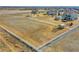 Large, fenced-in property with ample space, small sheds, and potential for various uses at 16360 Paris Way, Brighton, CO 80602