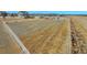 Spacious, fenced lot ready for your creative landscaping or agricultural endeavors at 16360 Paris Way, Brighton, CO 80602