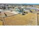 Expansive lot with a charming home, deck, playground, and fenced yard next to a pond at 16360 Paris Way, Brighton, CO 80602