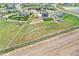 Aerial view showing large lot with fencing, playground and grass at 16360 Paris Way, Brighton, CO 80602