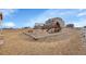 Large backyard with a playground and plenty of space for outdoor activities at 16360 Paris Way, Brighton, CO 80602