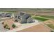 Aerial of a two-story home with solar panels and a large backyard at 16360 Paris Way, Brighton, CO 80602