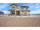 Charming two-story home featuring stone accents and a covered front porch, perfect for enjoying the outdoors at 16360 Paris Way, Brighton, CO 80602