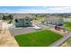 Charming two-story home features a lush green yard, playground, and a detached garage in a serene, Gathering-friendly neighborhood at 16360 Paris Way, Brighton, CO 80602