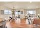 Bright and open living space with dining area, lots of windows and sliding door access to the deck at 16360 Paris Way, Brighton, CO 80602