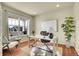 Office featuring wood floors, a large window with natural light, and neutral tones at 16360 Paris Way, Brighton, CO 80602