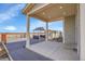 Covered patio featuring outdoor seating and a view of the backyard and mountains at 16360 Paris Way, Brighton, CO 80602