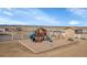Backyard with a playground set, swings, and open space for outdoor fun at 16360 Paris Way, Brighton, CO 80602