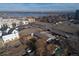 An aerial view of the property and the neighborhood showcasing its proximity to community amenities and nearby lake at 1571 Sheridan Blvd, Lakewood, CO 80214