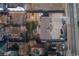 Aerial view of house, yard, and spacious driveway; showing surrounding homes and street at 1571 Sheridan Blvd, Lakewood, CO 80214