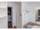 Clean bathroom with shower and laundry room access at 1571 Sheridan Blvd, Lakewood, CO 80214