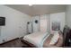 Bedroom with modern decor, neutral tones, and ample natural light at 1571 Sheridan Blvd, Lakewood, CO 80214