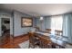 Elegant dining room features modern furnishings, creating a perfect setting for Gathering gatherings and dinner parties at 1571 Sheridan Blvd, Lakewood, CO 80214