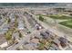 Aerial view of a neighborhood with tree-lined streets, and proximity to community baseball fields and parks at 3166 W Indian Summer Ln, Castle Rock, CO 80109