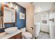 Stylish bathroom with modern fixtures, vessel sink, and a laundry room next to it at 3166 W Indian Summer Ln, Castle Rock, CO 80109