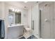 Modern bathroom featuring a glass door shower, gray vanity, toilet, and neutral walls at 3166 W Indian Summer Ln, Castle Rock, CO 80109