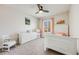 Bright bedroom featuring a bed, a dresser, a chair, neutral walls, a ceiling fan, and a carpeted floor at 3166 W Indian Summer Ln, Castle Rock, CO 80109