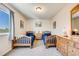 Bright bedroom featuring two twin beds, a dresser, neutral walls, and a carpeted floor with a large window at 3166 W Indian Summer Ln, Castle Rock, CO 80109