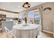 Cozy dining area featuring a white table and a glass sliding doors to the deck at 3166 W Indian Summer Ln, Castle Rock, CO 80109