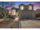 Charming two-story home with a well-manicured lawn and inviting curb appeal at 3166 W Indian Summer Ln, Castle Rock, CO 80109