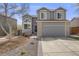 Charming two-story home with a well-manicured lawn and inviting curb appeal at 3166 W Indian Summer Ln, Castle Rock, CO 80109