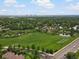 Scenic aerial view of a neighborhood with a lake and downtown skyline at 5860 W Atlantic Dr, Lakewood, CO 80227