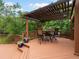 Outdoor wooden deck with a pergola and outdoor furniture at 5860 W Atlantic Dr, Lakewood, CO 80227