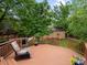Deck overlooking backyard with mature trees at 5860 W Atlantic Dr, Lakewood, CO 80227