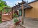 Backyard patio with arbor and a garden with colorful red roses at 5860 W Atlantic Dr, Lakewood, CO 80227