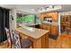 Well-lit kitchen with updated countertops, cabinetry, and a breakfast bar for casual dining at 5860 W Atlantic Dr, Lakewood, CO 80227