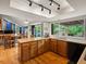 Modern kitchen featuring sleek countertops, plenty of cabinet storage, and adjacent dining area with outdoor access at 5860 W Atlantic Dr, Lakewood, CO 80227