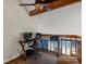 Upstairs loft office space with a computer, ceiling fan and natural light at 5860 W Atlantic Dr, Lakewood, CO 80227