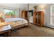 Primary bedroom featuring vaulted ceilings, wood furniture, and natural light at 5860 W Atlantic Dr, Lakewood, CO 80227