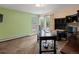Home office with dual monitors, built-in shelves, and natural light at 5860 W Atlantic Dr, Lakewood, CO 80227