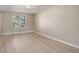 An empty bedroom featuring natural light and white-toned walls, providing a blank canvas for personal design at 7165 S Gaylord St # E09, Centennial, CO 80122