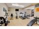 Well-equipped gym featuring a treadmill, bikes, and weight machines at 7165 S Gaylord St # E09, Centennial, CO 80122