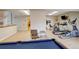 Recreational area with a gym, pool table, and comfortable seating at 7165 S Gaylord St # E09, Centennial, CO 80122