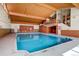 Bright indoor pool with wood-paneled ceilings and plenty of natural light at 7165 S Gaylord St # E09, Centennial, CO 80122