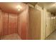 Storage hallway shows a corner unit with wood paneling and secure locking at 7165 S Gaylord St # E09, Centennial, CO 80122