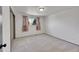 Bedroom with neutral carpet, window, and closet with sliding doors at 3792 S Fenton Way, Denver, CO 80235