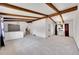 Spacious open concept living room featuring vaulted ceilings with exposed beams at 3792 S Fenton Way, Denver, CO 80235