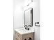 Modern bathroom featuring vanity with framed mirror and sleek black hardware at 15977 Red Bud Dr, Parker, CO 80134
