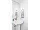 Classic pedestal sink bathroom with decorative mirror and stylish fixtures provides a clean and functional space at 15977 Red Bud Dr, Parker, CO 80134